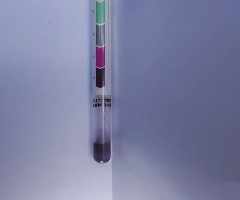 ProClean surface hygiene swab test displaying a dark purple failed result, indicating heavy protein residue and biological contamination before fleet detailing in Calgary